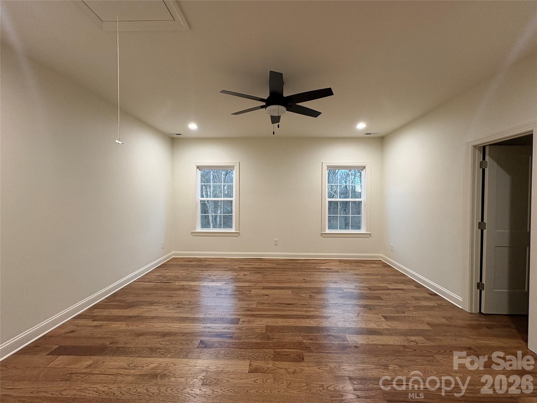 7217 Tesh Road, Unit 5 Monroe, NC 28110 - Photo 30 of 48 a view of empty room with wooden floor and fan