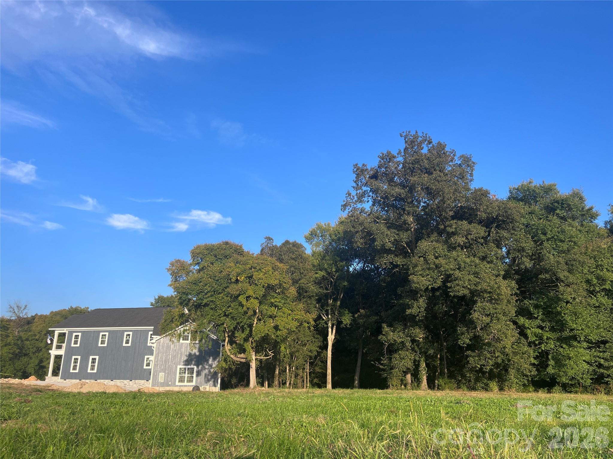 7217 Tesh Road, Unit 5 Monroe, NC 28110 - Photo 3 of 48 a view of a big yard with large trees