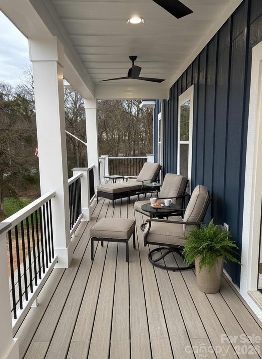 7217 Tesh Road, Unit 5 Monroe, NC 28110 - Photo 44 of 48 a view of balcony with chairs and wooden floor