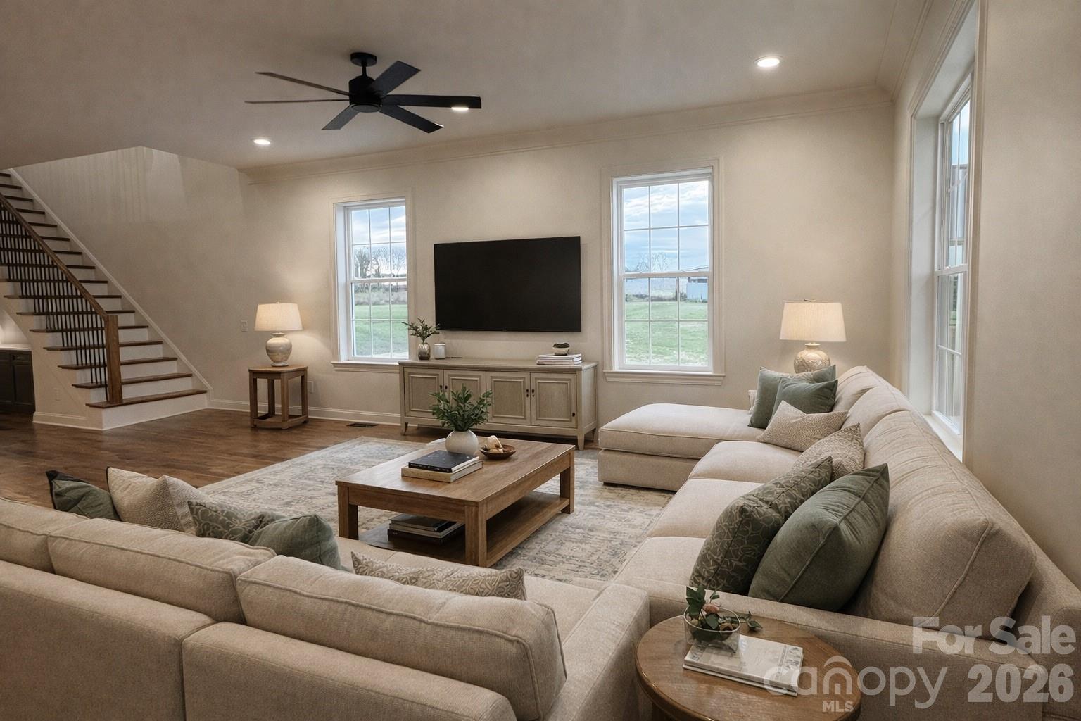 7217 Tesh Road, Unit 5 Monroe, NC 28110 - Photo 6 of 48 a living room with furniture a ceiling fan and a window