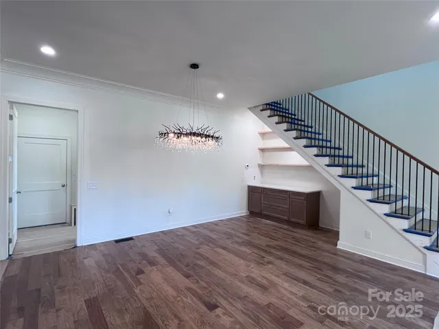 a kitchen with kitchen island granite countertop a sink and a stove