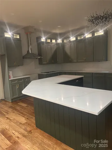 a view of a kitchen with cabinets