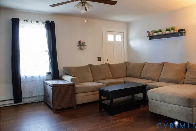 a living room with furniture and a window