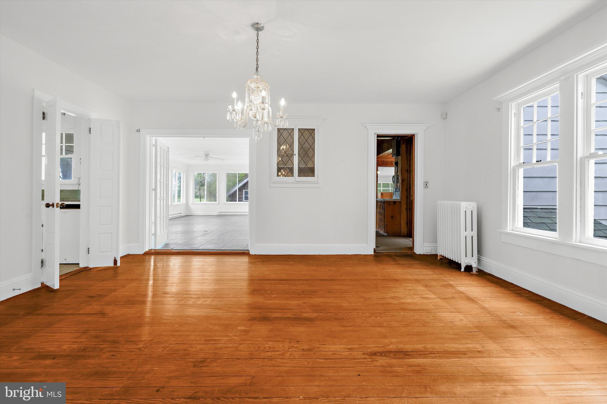 500 Nesbit Road Queenstown, MD 21658 - Photo 11 of 53 a view of an empty room with window and wooden floor