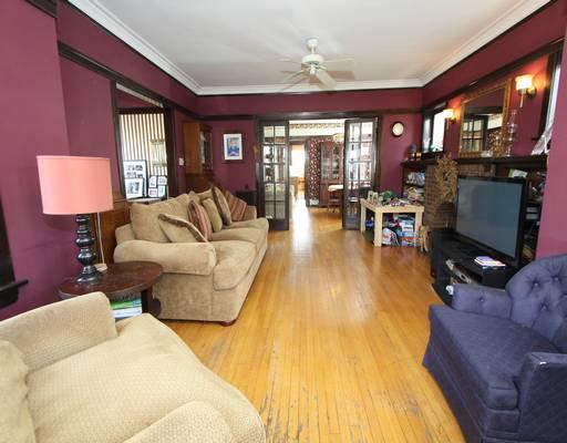 6732 Riverside Drive Berwyn, IL 60402 - Photo 3 of 16 a living room with furniture and a flat screen tv