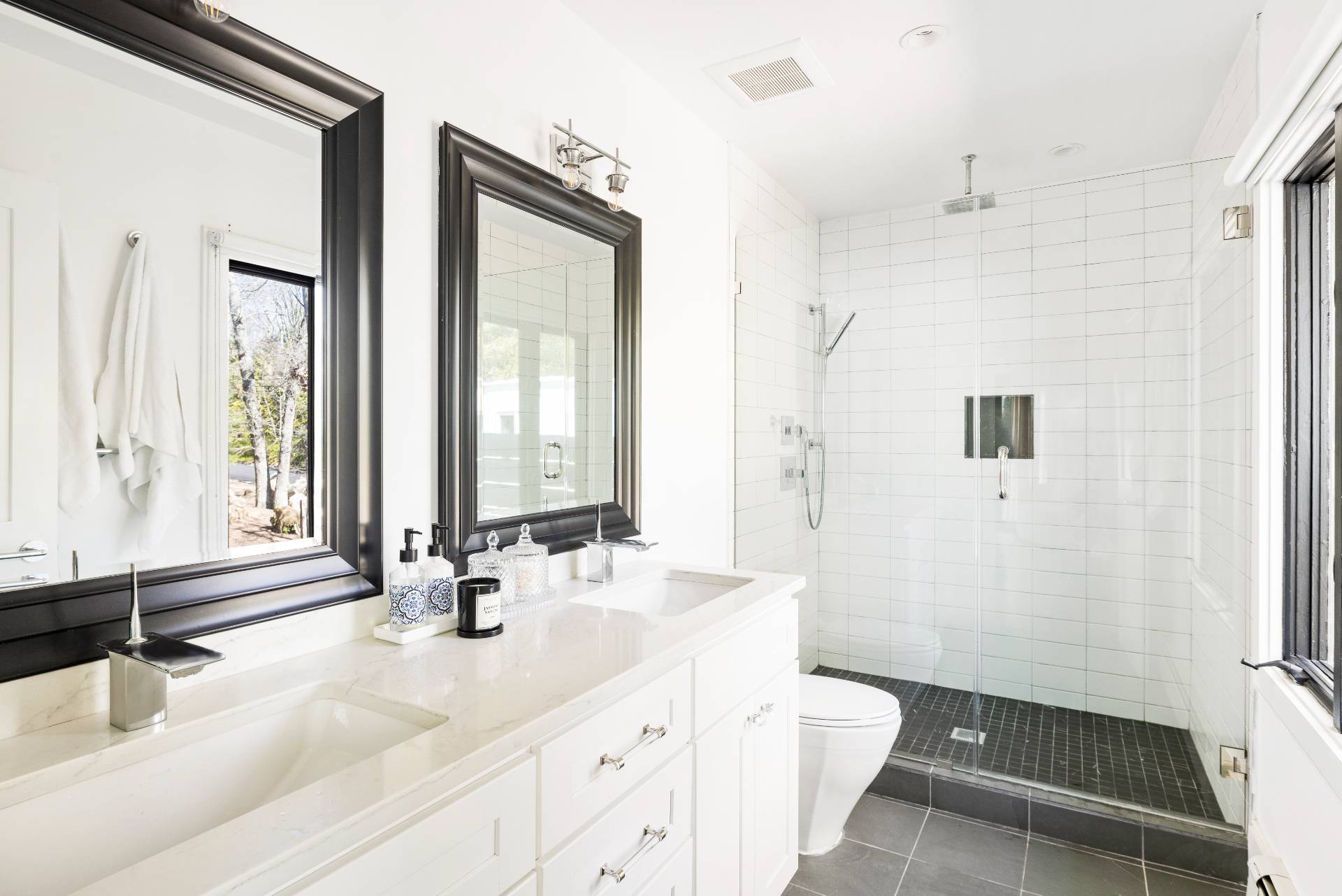 1 High Point Road East Hampton, NY 11937 - Photo 11 of 18 a bathroom with a double vanity sink toilet and a mirror