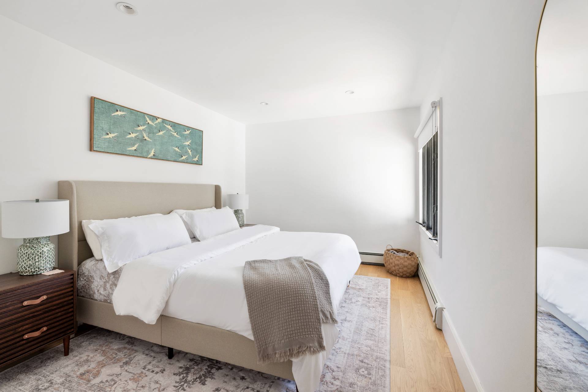 1 High Point Road East Hampton, NY 11937 - Photo 13 of 18 a bedroom with a bed and a painting on the wall