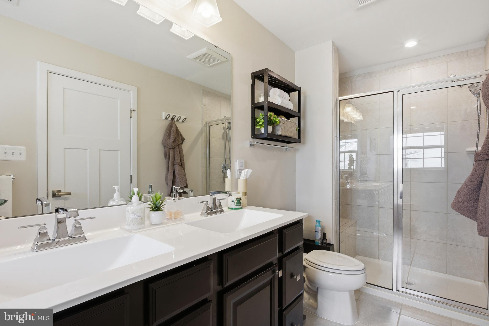 103 Freedom Way Sicklerville, NJ 08081 - Photo 22 of 43 a bathroom with a sink toilet and shower