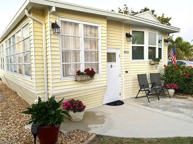 a potted plant sitting on the side of a brick house