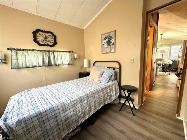 a bedroom with a bed and a table