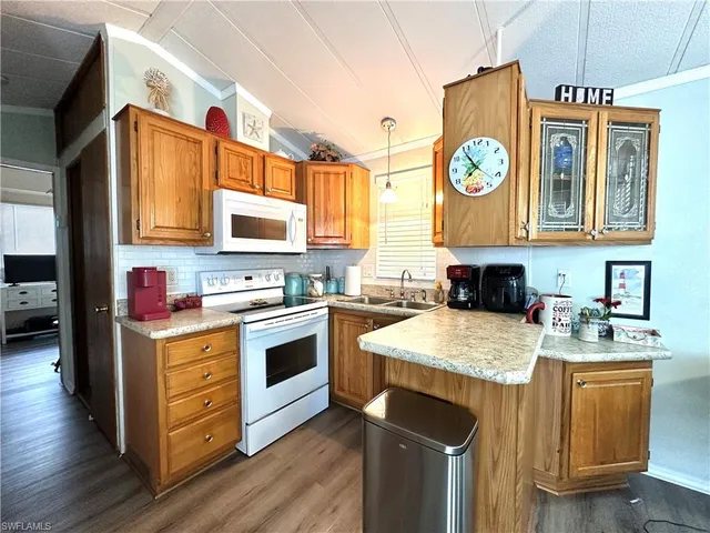 a kitchen with stainless steel appliances granite countertop a stove and a refrigerator