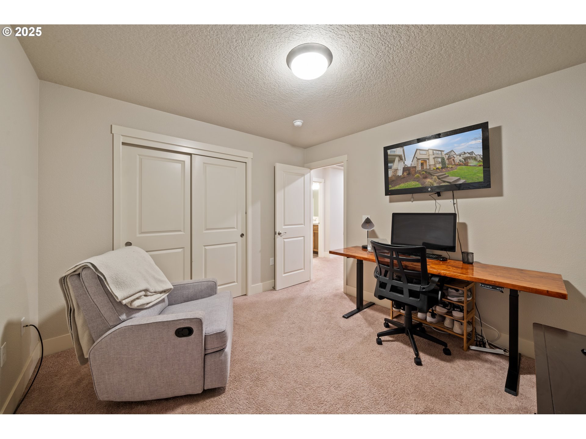 14224 Southwest 169th Avenue Portland, OR 97223 - Photo 21 of 37 a living room with furniture and a flat screen tv