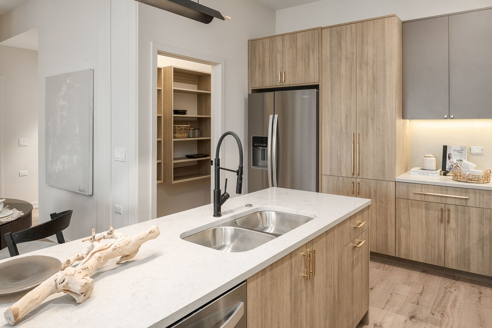 8000 O Connor Drive, Unit 206 River Grove, IL 60171 - Photo 6 of 52 a kitchen with a sink and a refrigerator