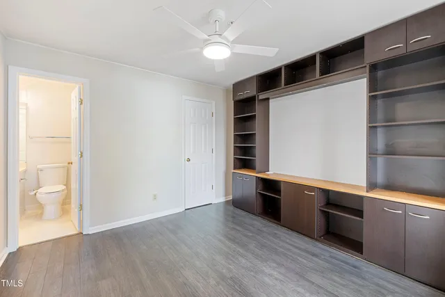 an aerial view of a house with a swimming pool and outdoor seating