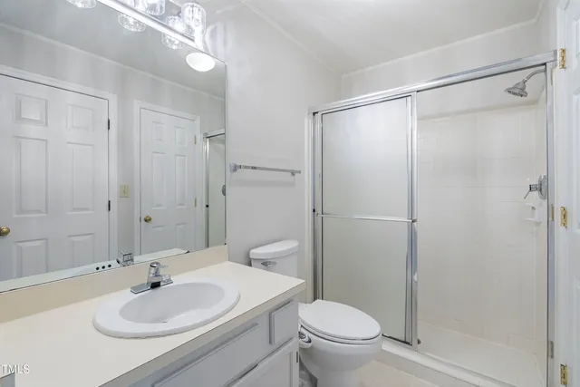 a view of a park with iron fence