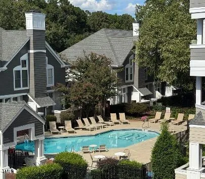 a view of a backyard with large trees