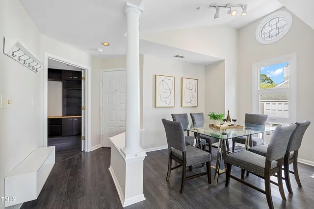 a view of a dining room with furniture and wooden floor
