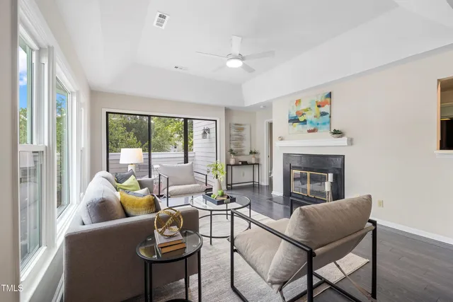 a living room with furniture and a fireplace