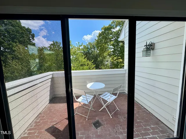 a view of a balcony with an outdoor space