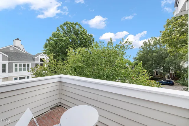 a view of living room with furniture and wooden floor