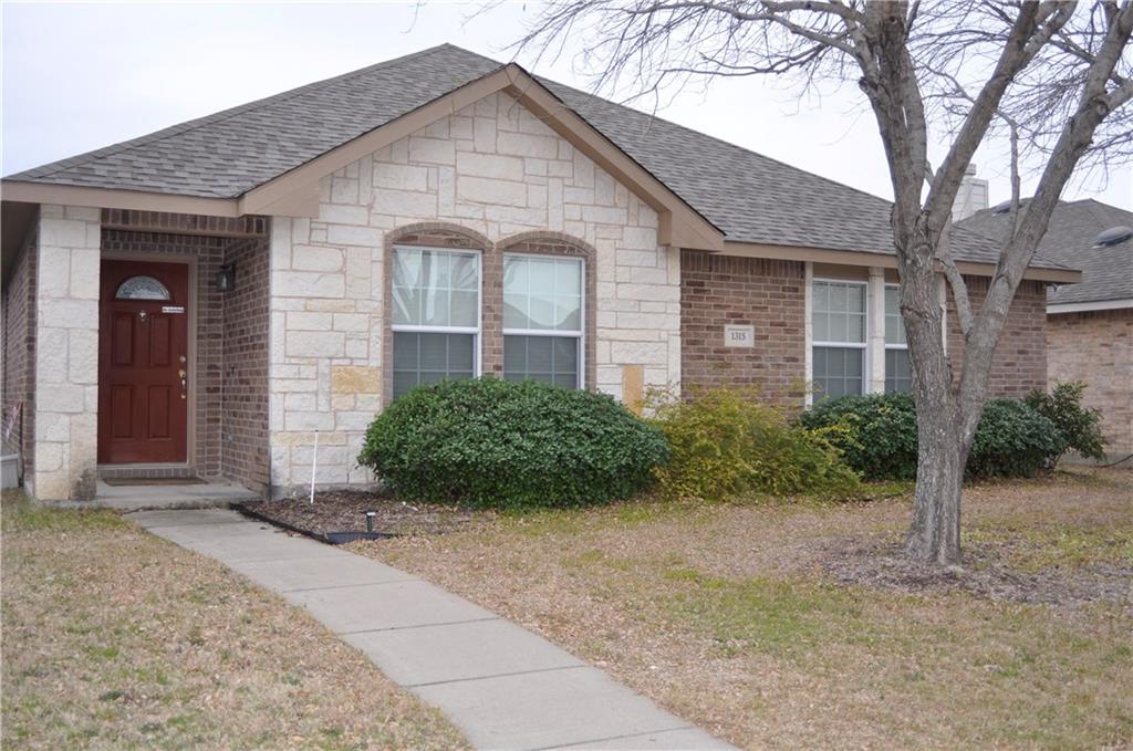 1315 Lamar Lane Allen, TX 75002 - Photo 1 of 1 a view of a brick house with a yard and large trees