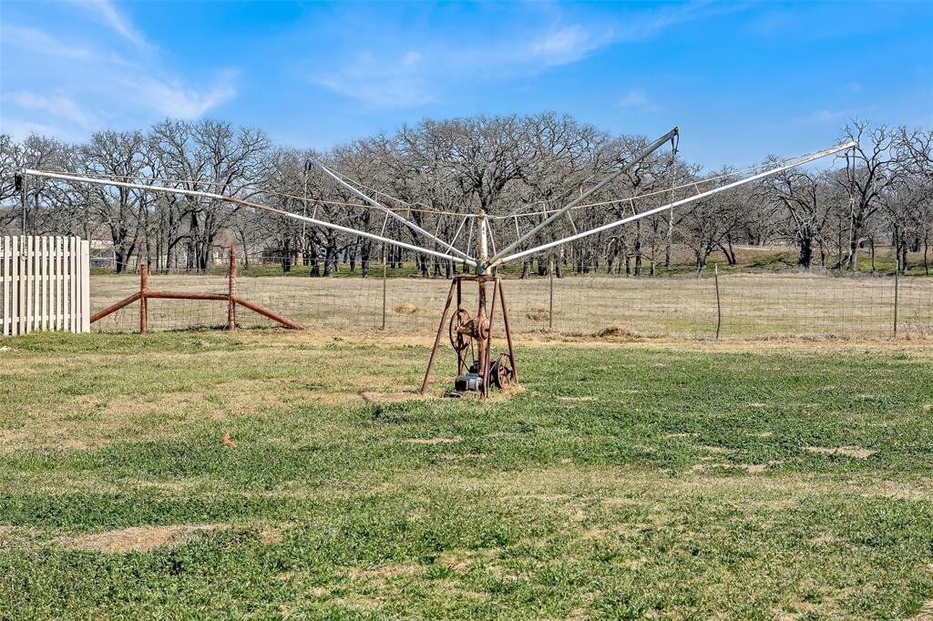 512 Allison Road Springtown, TX 76082 - Photo 20 of 32 a view of a yard with a slide