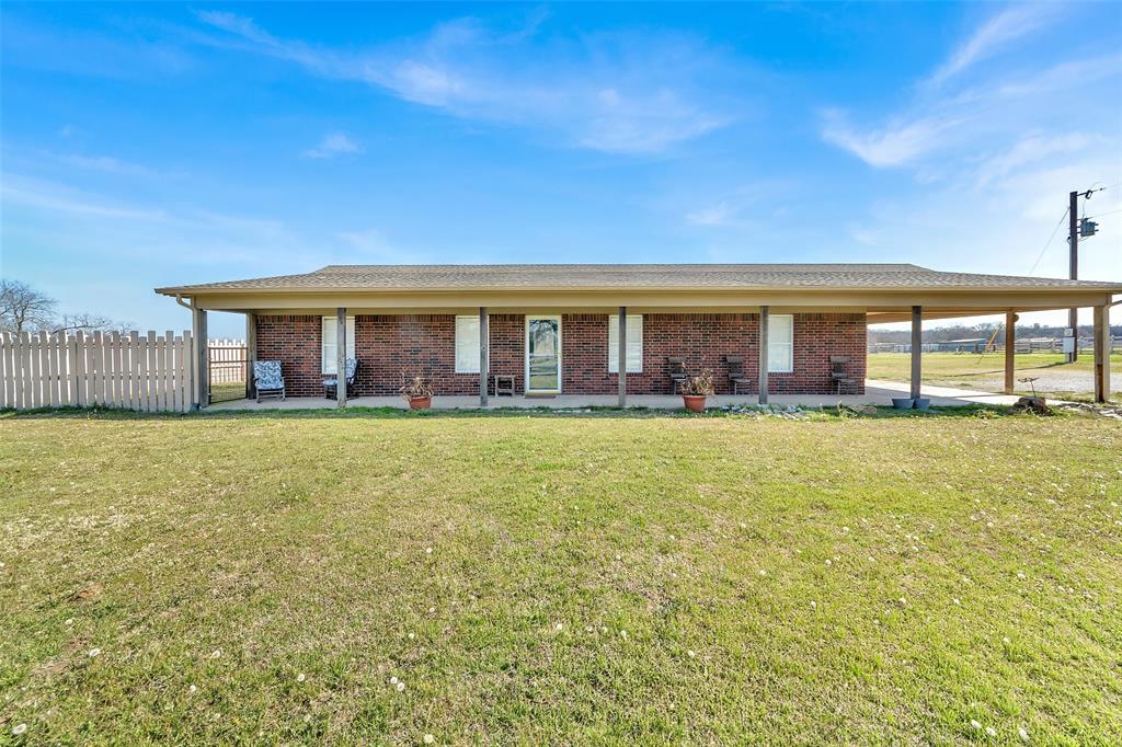 512 Allison Road Springtown, TX 76082 - Photo 2 of 32 a front view of house with outdoor space and swimming pool