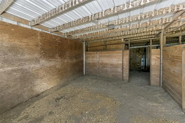 a view of a room with wooden walls