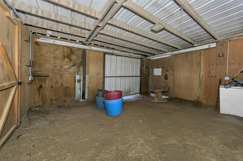 512 Allison Road Springtown, TX 76082 - Photo 25 of 32 a view of a room with wooden walls