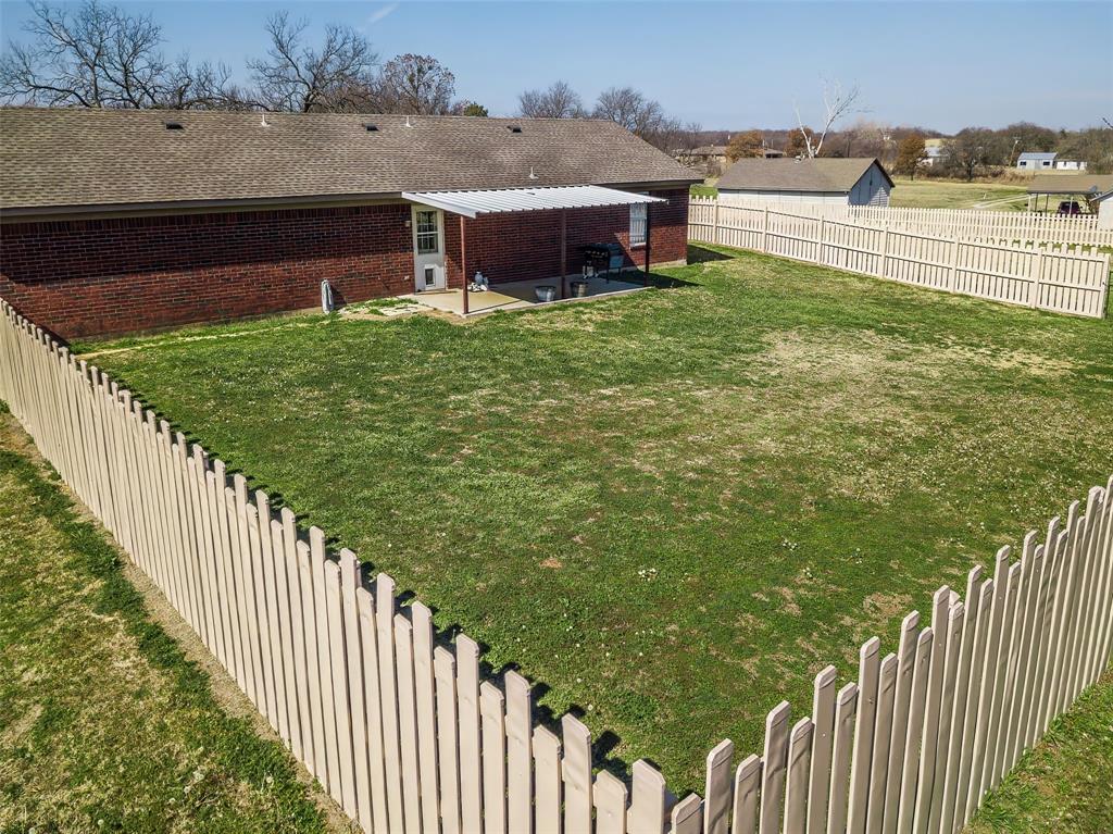 512 Allison Road Springtown, TX 76082 - Photo 31 of 32 a view of a terrace with yard