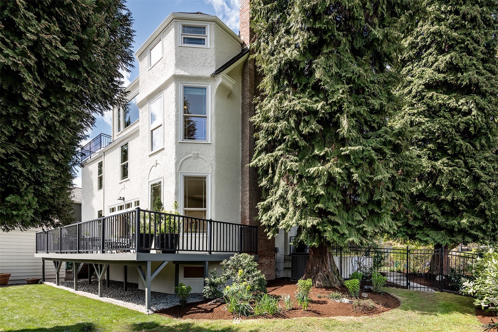 830 35th Avenue Seattle, WA 98122 - Photo 13 of 40 a front view of a house with a tree