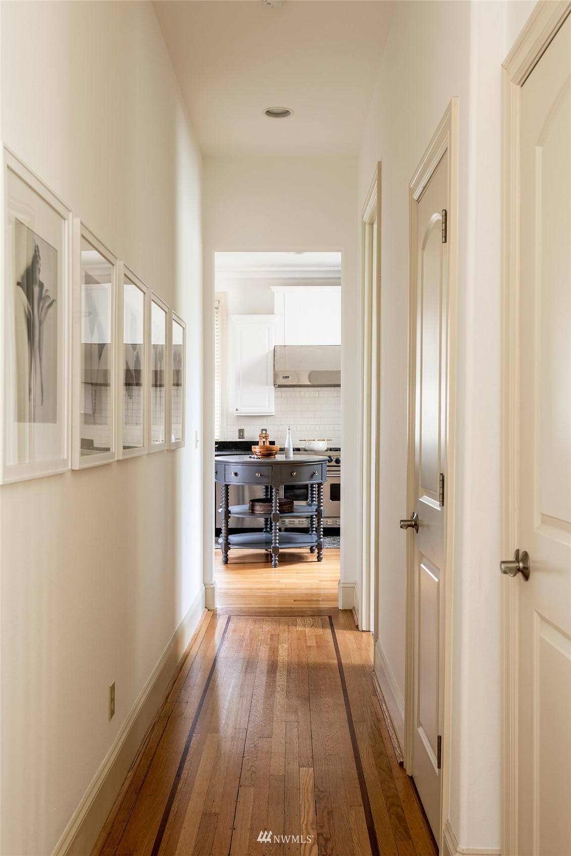 830 35th Avenue Seattle, WA 98122 - Photo 14 of 40 a view of a room with wooden floor furniture and windows