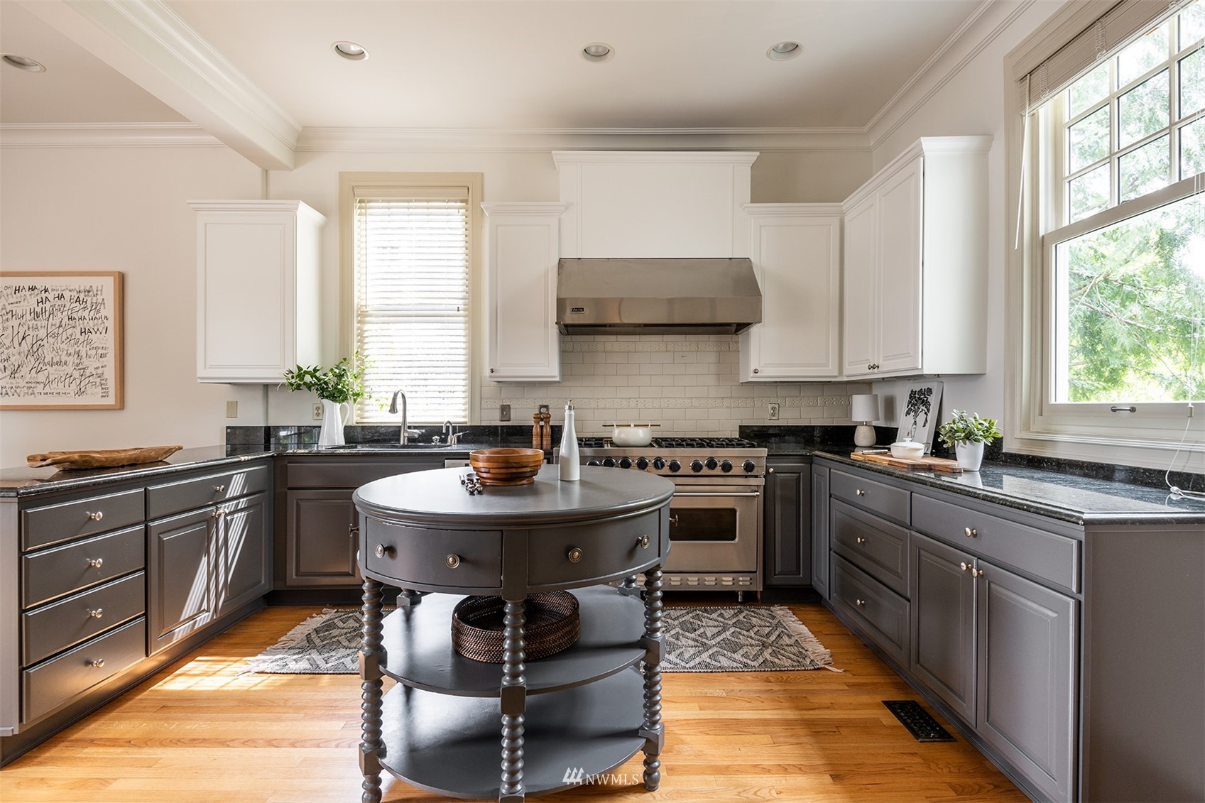 830 35th Avenue Seattle, WA 98122 - Photo 15 of 40 a kitchen with a sink stove and cabinets