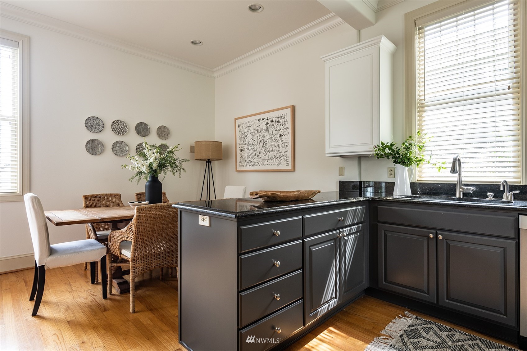 830 35th Avenue Seattle, WA 98122 - Photo 17 of 40 a kitchen with stainless steel appliances granite countertop a sink and cabinets