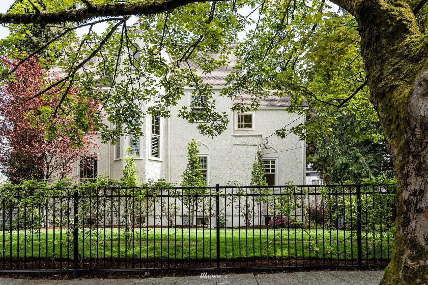 830 35th Avenue Seattle, WA 98122 - Photo 2 of 40 a view of a wrought iron fences in front of a yard