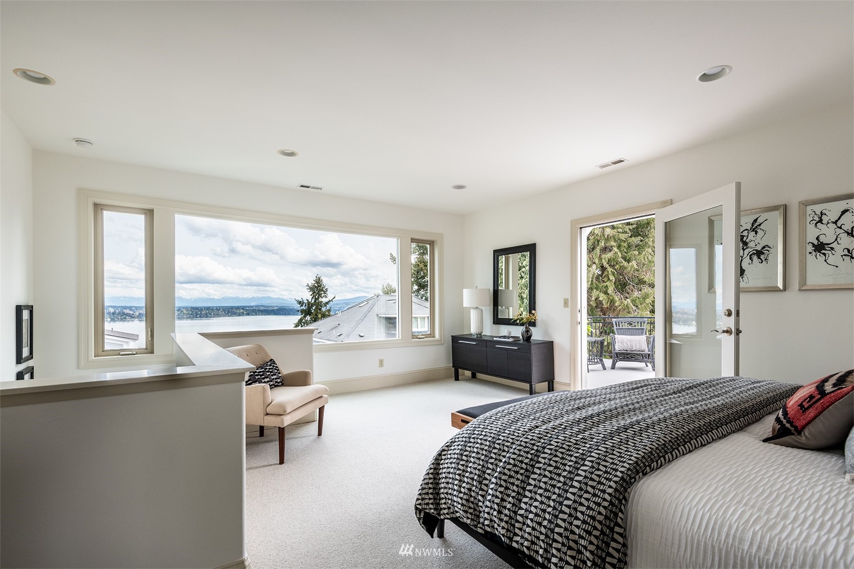 830 35th Avenue Seattle, WA 98122 - Photo 26 of 40 a bedroom with a bed and large windows