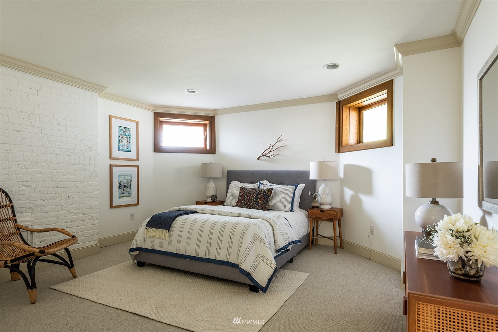 830 35th Avenue Seattle, WA 98122 - Photo 36 of 40 a bedroom with a bed potted plant on dresser and a window