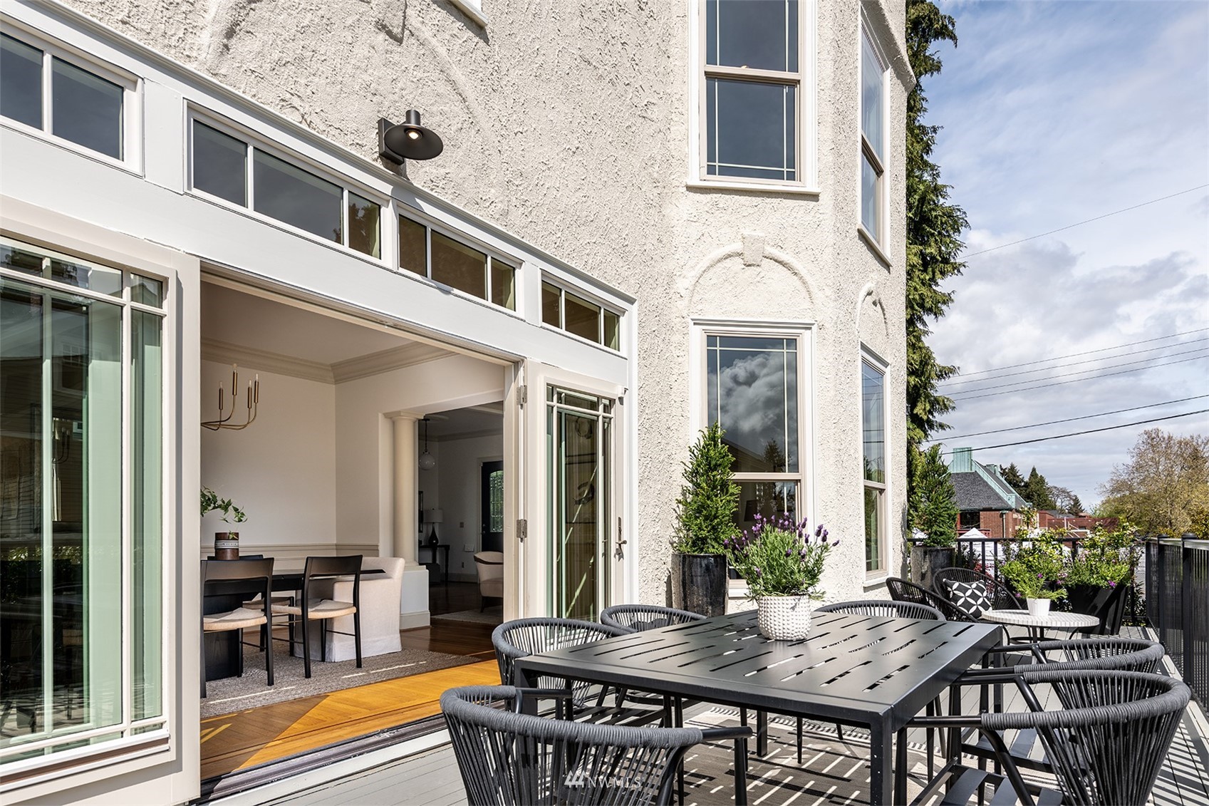 830 35th Avenue Seattle, WA 98122 - Photo 10 of 40 a view of a dinning table and chairs in patio of the house