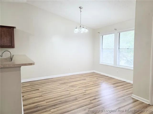 a view of kitchen with wooden floor