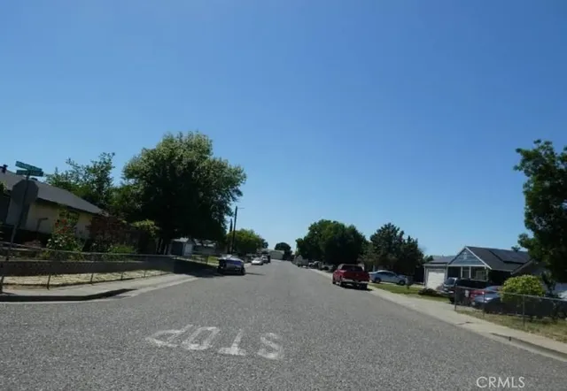 a view of street with parked cars
