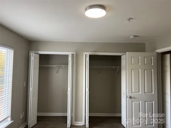 an empty room with closet area