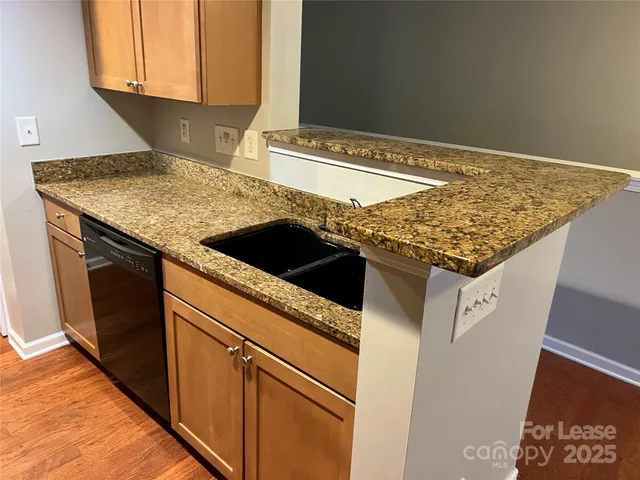 a kitchen with a stove and a microwave