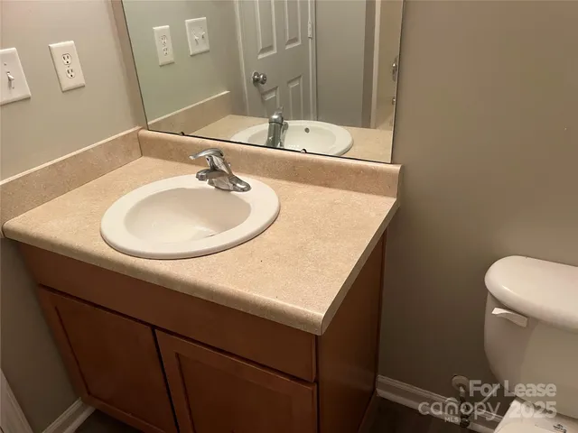 a bathroom with a sink and a toilet