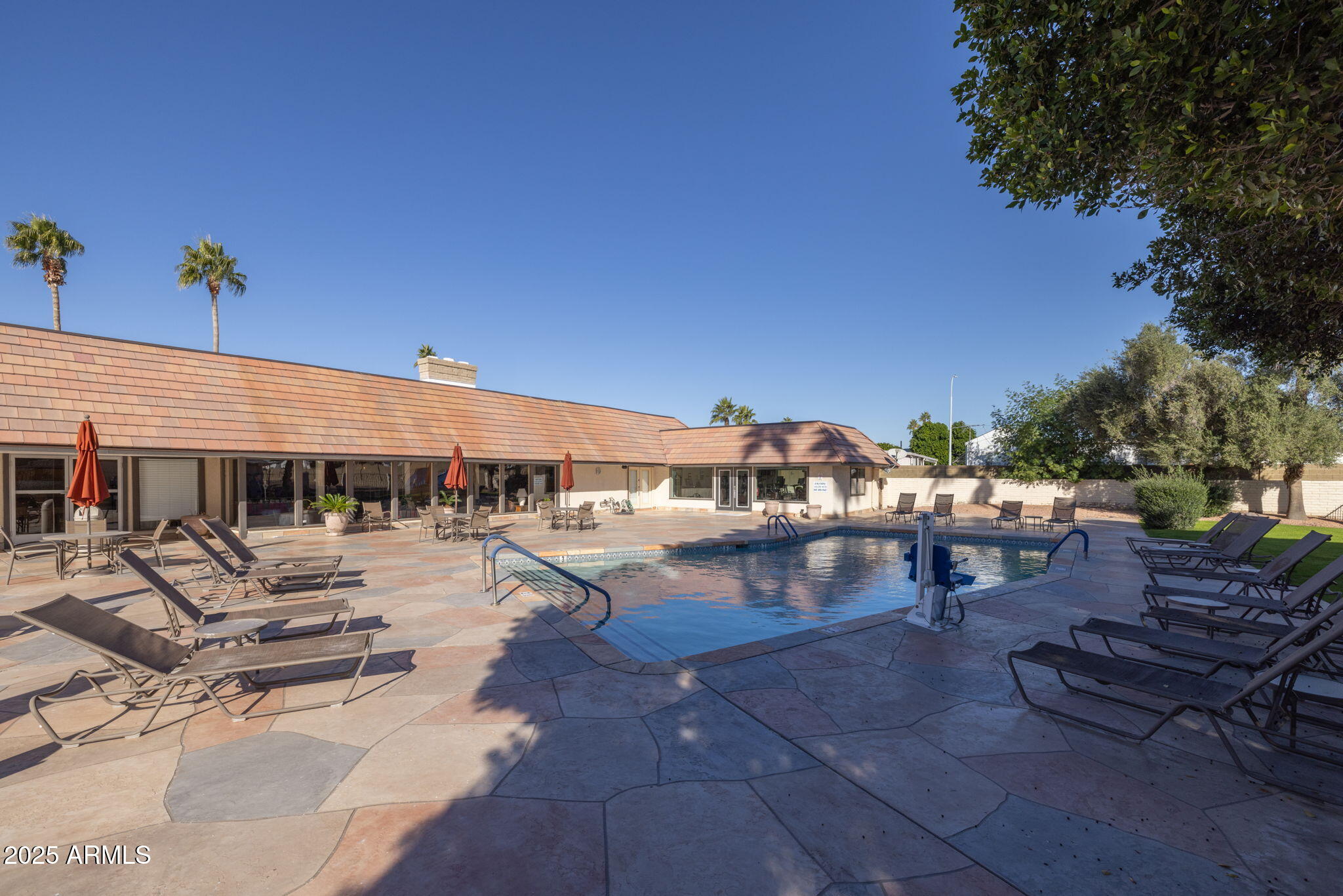 201 South Greenfield Road, Unit 310 Mesa, AZ 85206 - Photo 28 of 34 a view of a patio with swimming pool