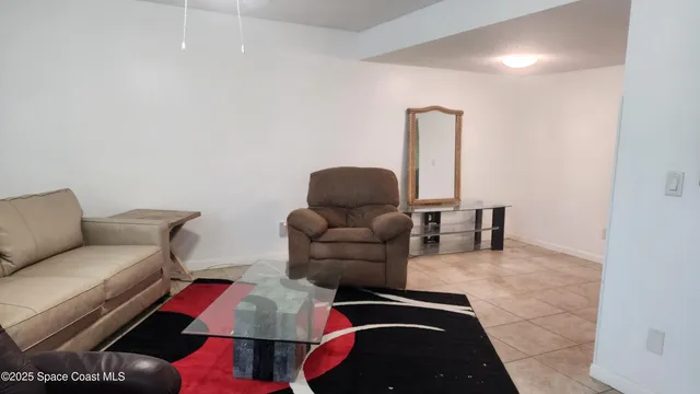 a living room with furniture and furniture