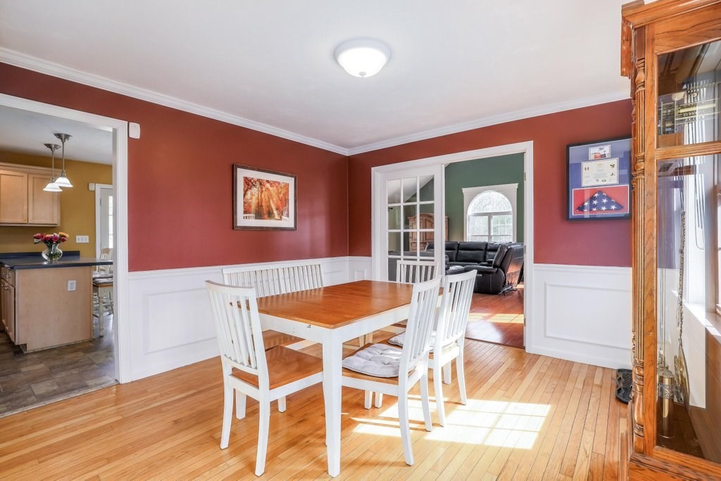 53 Baker Pond Road Charlton, MA 01507 - Photo 12 of 27 a view of a dining room with furniture and wooden floor