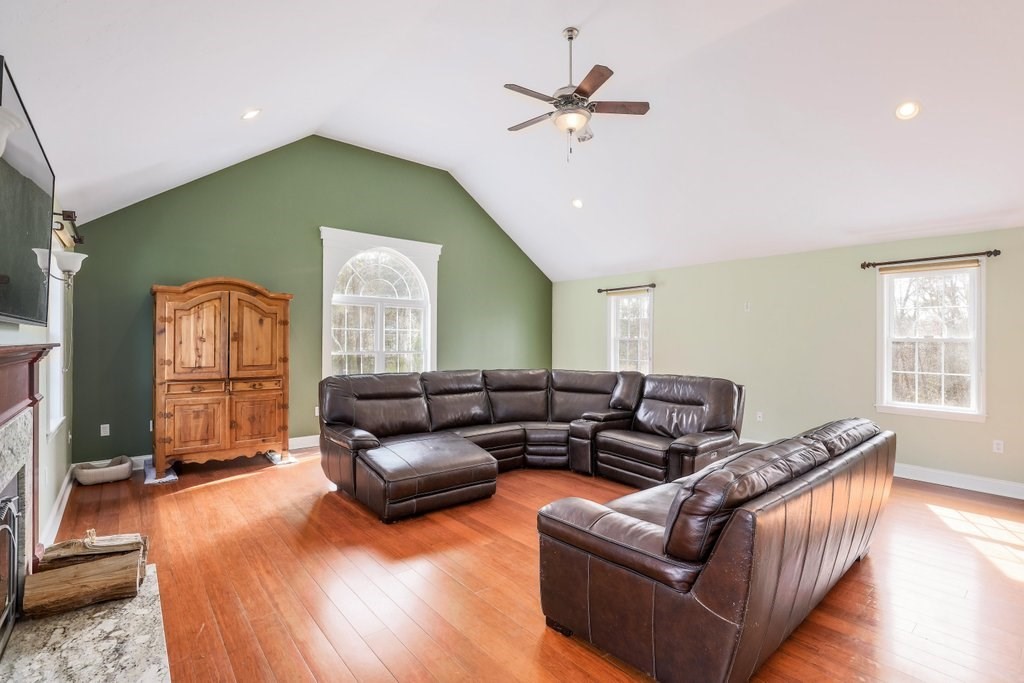 53 Baker Pond Road Charlton, MA 01507 - Photo 13 of 27 a living room with furniture and a wooden floor