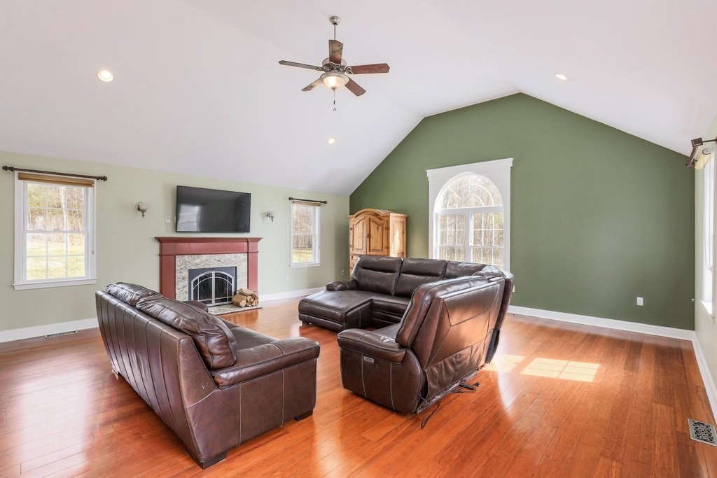 53 Baker Pond Road Charlton, MA 01507 - Photo 14 of 27 a living room with furniture and a fireplace