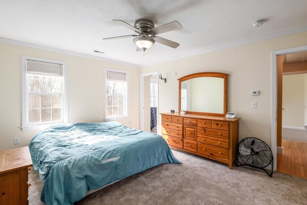 53 Baker Pond Road Charlton, MA 01507 - Photo 23 of 27 a bedroom with a bed and a dresser