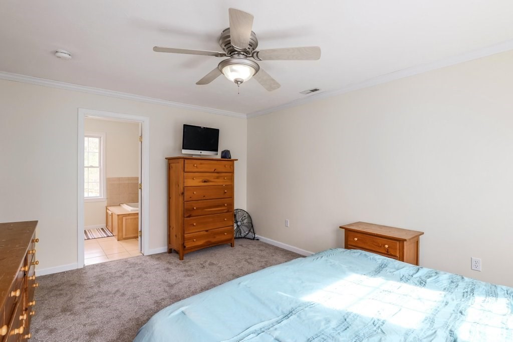 53 Baker Pond Road Charlton, MA 01507 - Photo 24 of 27 a bedroom with a bed and a television